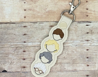 Golden ladies embroidered key chain/snap tab