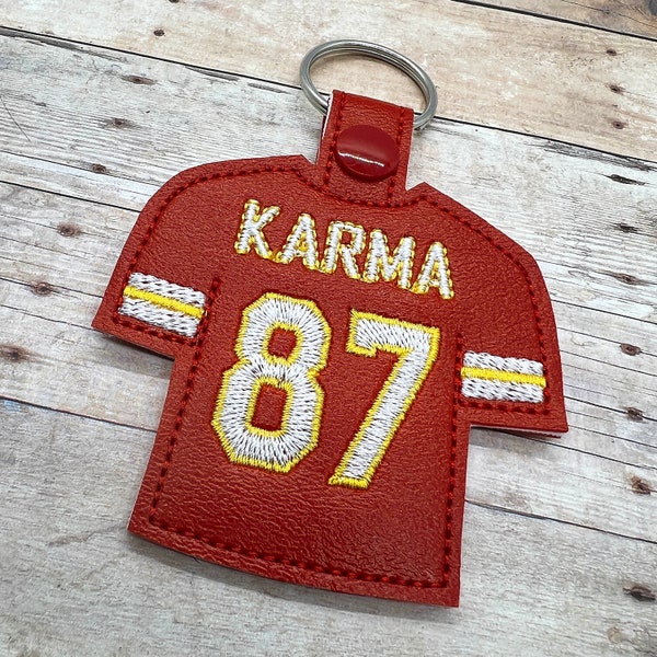 Karma 87, embroidered key chain, snap tab