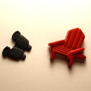 May include: A pair of black binoculars and a red plastic Adirondack chair.