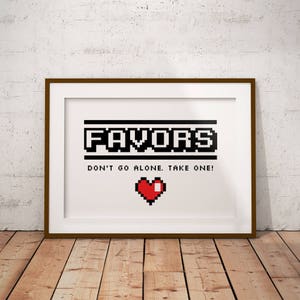 May include: A framed print with a pixelated design that says "Favors Don't go alone. Take one!" with a red pixelated heart below the text.