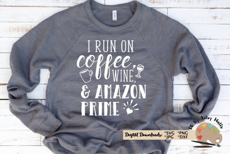 May include: Gray sweatshirt with white text that reads "I run on coffee, wine, & Amazon Prime" with a coffee cup, wine glass, and heart graphic.