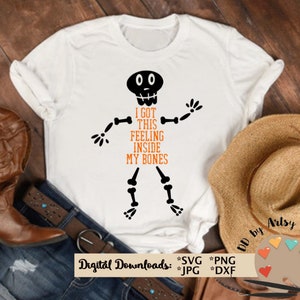 May include: White t-shirt with a black skeleton graphic and the text "I got this feeling inside my bones".