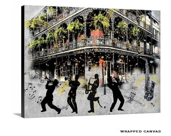 May include: Wrapped canvas art print featuring a black and white illustration of a New Orleans building with a wrought iron balcony. Silhouetted musicians play instruments in the foreground, with musical notes and gold accents. The words "Wrapped Canvas" are in the bottom right corner.