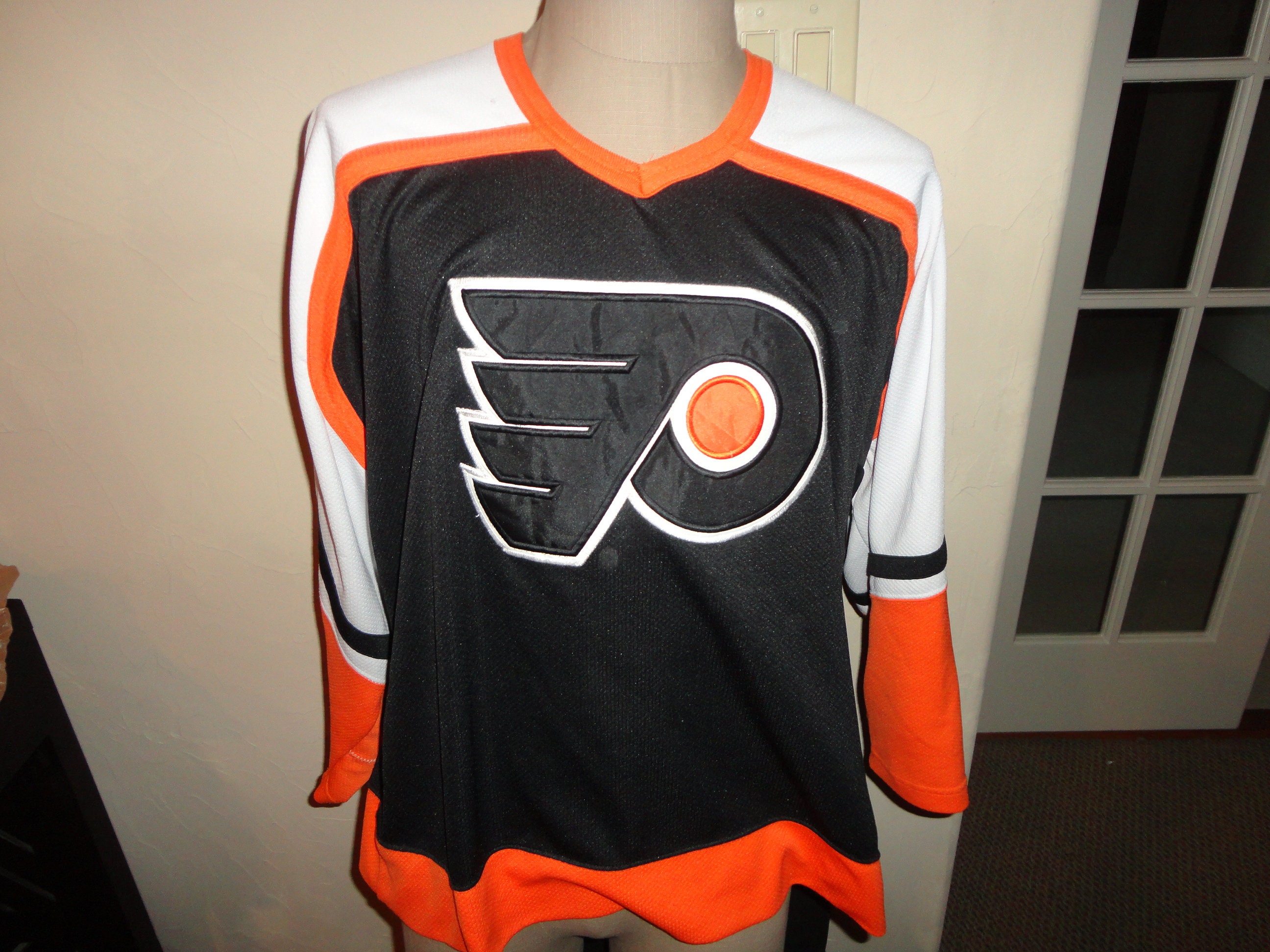 Men's Starter Orange/Black Philadelphia Flyers Cross Check Jersey