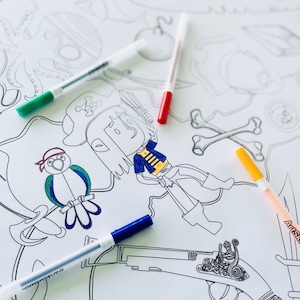 May include: A coloring page featuring a pirate with a parrot, a sword, and a treasure chest. The page is partially colored with blue, green, yellow, and red markers.