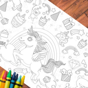 May include: A black and white coloring page featuring a unicorn with wings, a rainbow, and various other whimsical designs. The page is perfect for kids to color and enjoy.