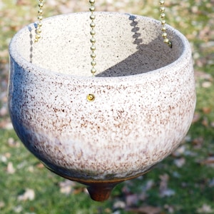 Hanging white speckled ceramic planter