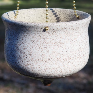 Hanging white speckled ceramic planter image 1