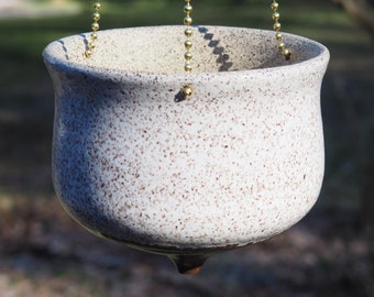 Hanging white speckled ceramic planter