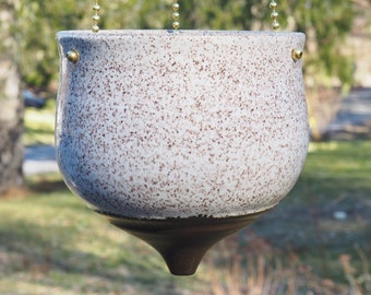 White speckled hanging pottery planter