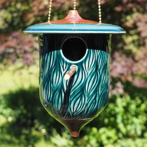 Hand-carved pottery birdhouse, Whispering Pines Estate