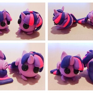 May include: Four views of handmade clay figurines. The figures are in the shape of a pony with purple, pink, and blue details. The ponies have large black eyes and are posed in different positions.