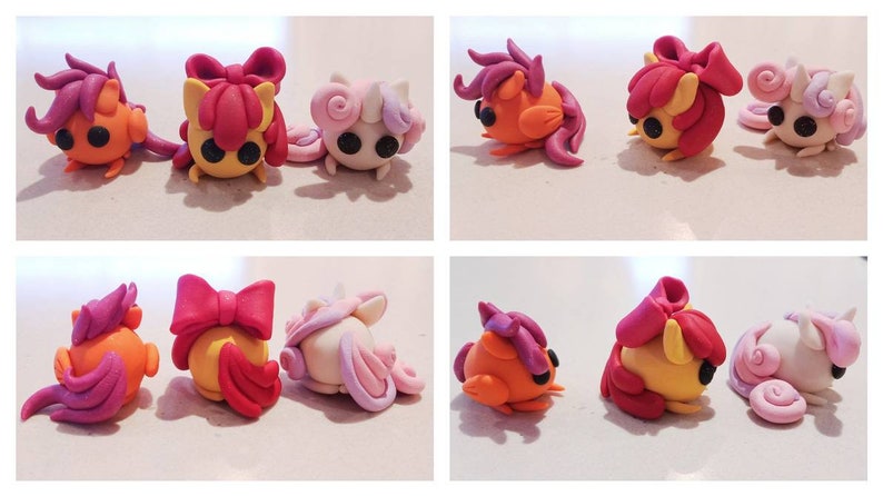 May include: A collection of handmade clay figurines in the shape of cartoon ponies. The ponies are in various poses and feature orange, yellow, pink, and purple colors. Each pony has black eyes and a unique hairstyle.