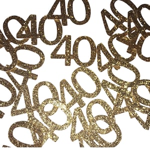 May include: Gold glitter confetti with the number 40 printed on each piece. The confetti is scattered on a white background.