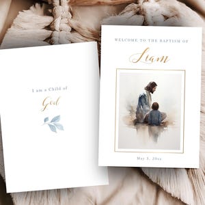 May include: Two white baptism cards. One card reads "I am a Child of God" with a blue leaf design. The other card says "Welcome to the Baptism of Liam" with an image of Jesus and a child. The date is May 5, 20xx.