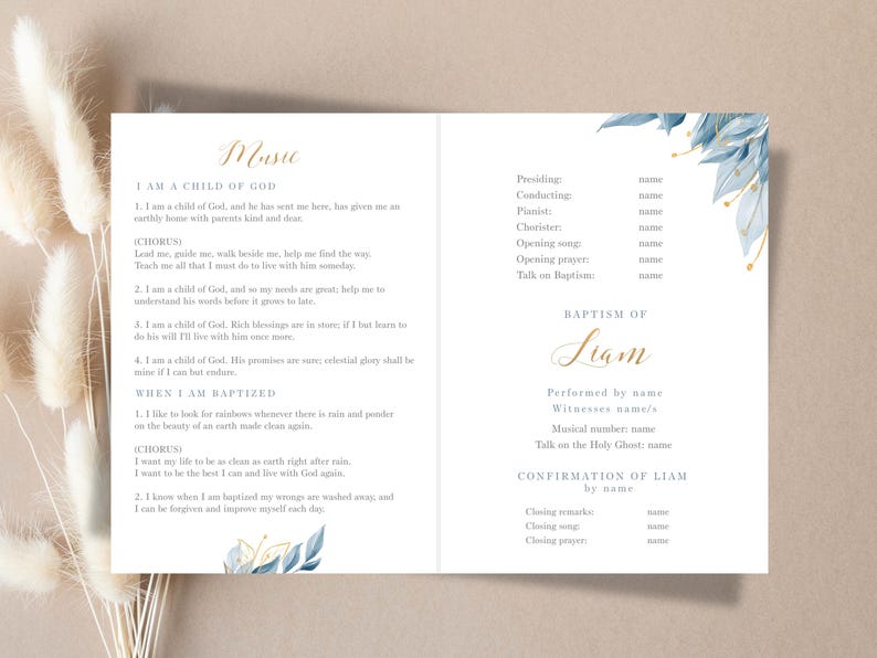 May include: A baptism program with a light beige background. The program features text in gold and black, with blue floral accents. The text includes the word "Music" and the name "Liam".
