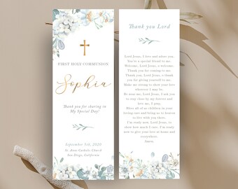 May include: A white bookmark with blue and white floral designs, a gold cross, and the text "First Holy Communion Sophia Thank you for sharing in My Special Day! September 5th, 2020 St. Anne Catholic Church San Diego, California". The bookmark also features a prayer to Lord Jesus.