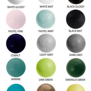May include: Twelve round ceramic knobs in various colours and finishes, including white gloss, white matt, black gloss, black matt, pastel pink, pastel mint, cobalt, light grey, dark grey, marine, lime green, emerald green, turquoise crackle, old gold, and yellow.