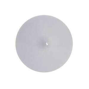 May include: A single, round, white candle with a slight indentation on top.