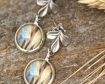 Leaf motif earrings for women. Silver scultped leaves with watercolor charms dangle earrings. Tan, cream and blue nature inspired earrings.