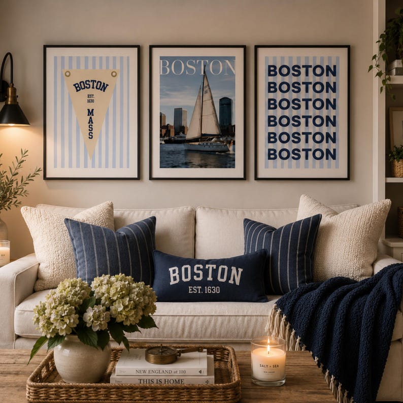 Boston wall art set of 3 featuring a vintage Boston pennant print, Boston sailboat skyline photography, and blue striped Boston typography poster in light wood frames.