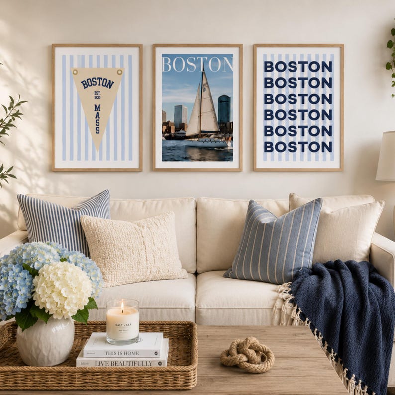Boston wall art set of 3 featuring a vintage Boston pennant print, Boston sailboat skyline photography, and blue striped Boston typography poster in light wood frames.