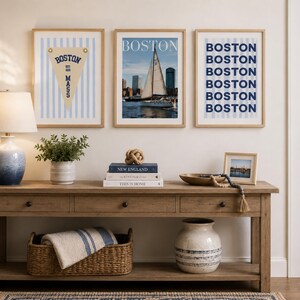 Boston wall art set of 3 featuring a vintage Boston pennant print, Boston sailboat skyline photography, and blue striped Boston typography poster in light wood frames.