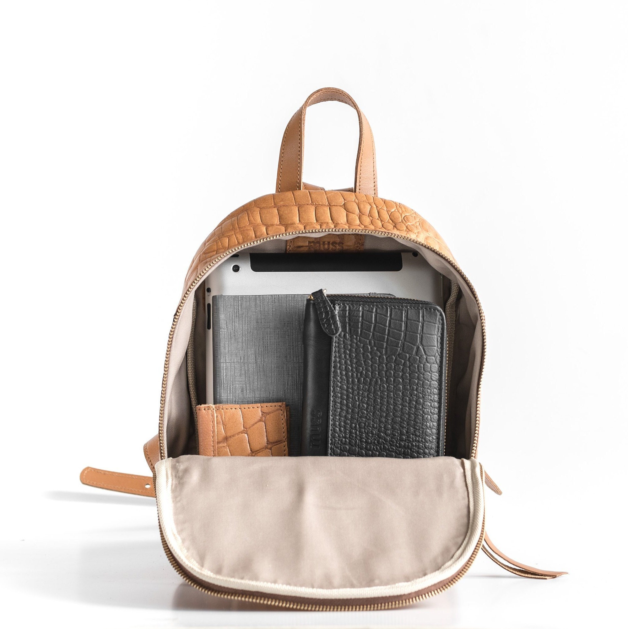 small tan leather backpack