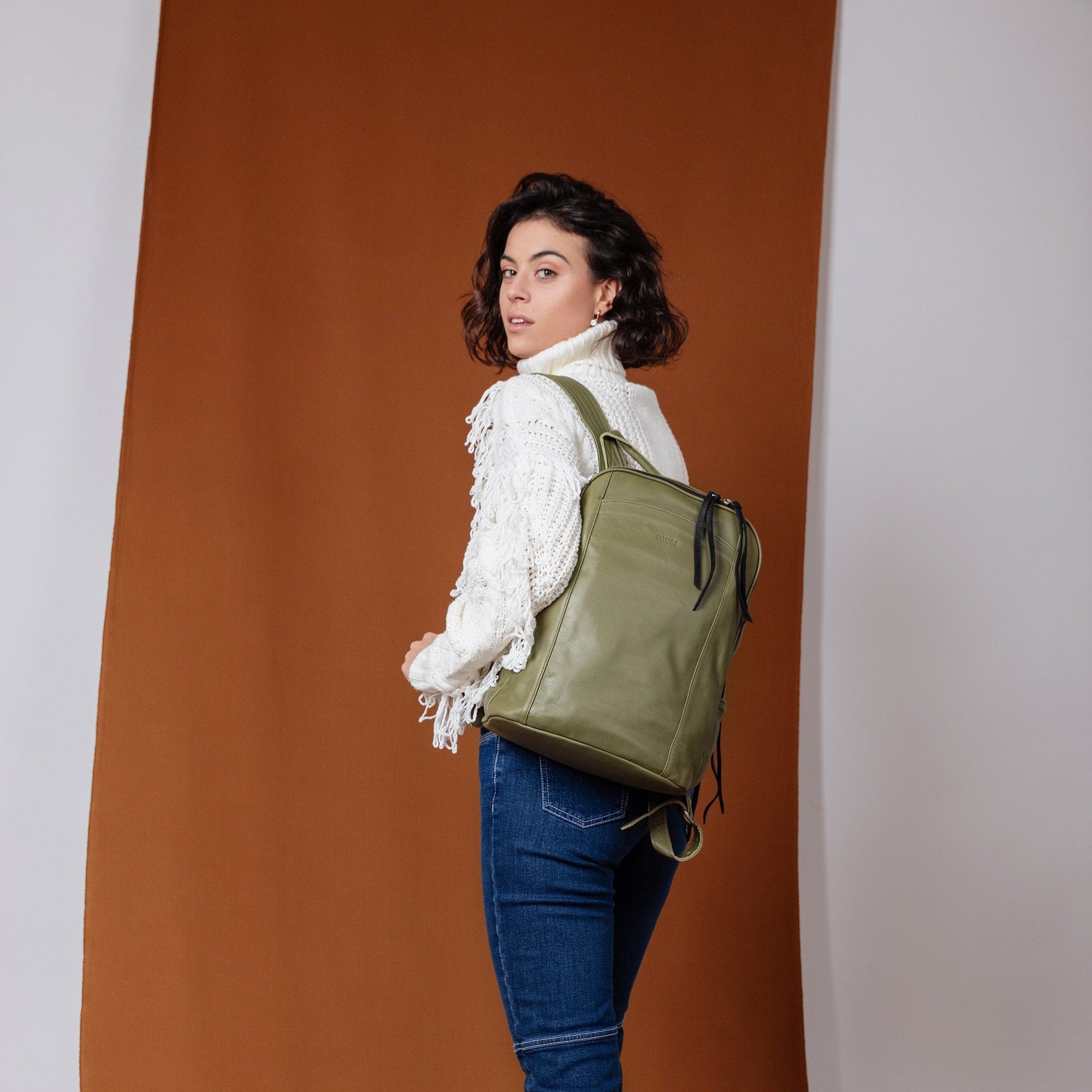 green leather rucksack