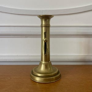 Antique French brass candlestick with sliding basement rat