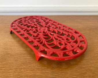 Vintage French red cast iron trivet, white cast iron mat