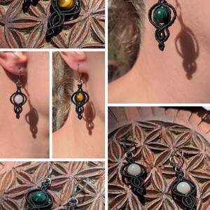 May include: Dangle earrings featuring black macrame cord woven into intricate patterns around spherical gemstones. The collection includes tiger's eye, malachite, and moonstone beads, each suspended from silver-toned metal lever-back ear wires.