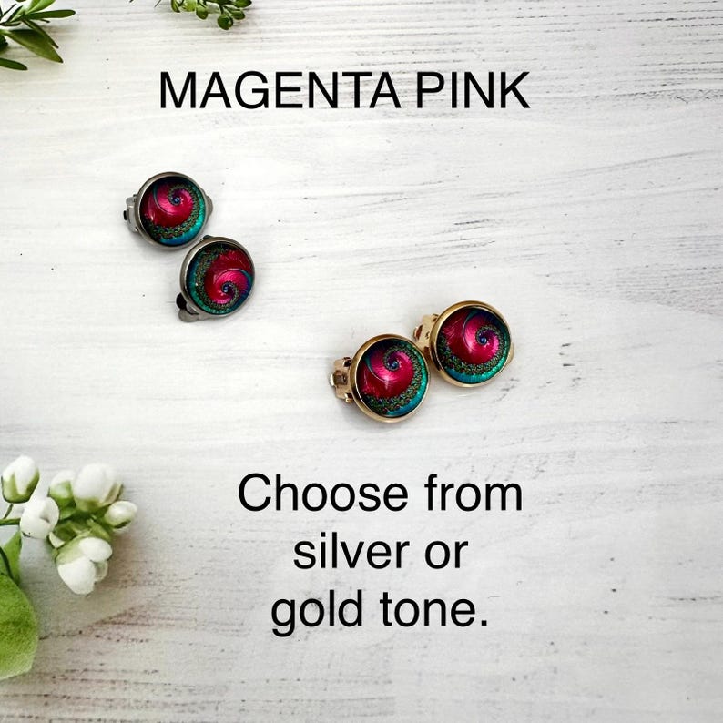 May include: Two pairs of round stud earrings featuring a magenta pink and teal spiral pattern. One pair is set in a silver tone metal and the other pair is set in a gold tone metal. The text MAGENTA PINK and Choose from silver or gold tone appear.