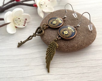 Steampunk earrings with cogs and gears, Mismatched dangly earrings with wing and key, Handmade in Britain, Steampunk jewellery in the UK,