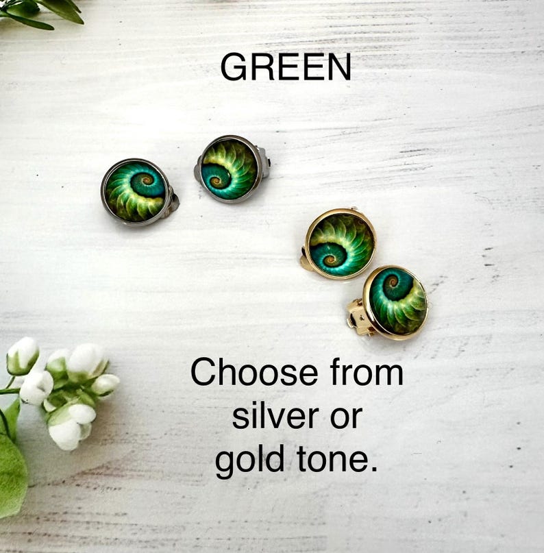 May include: Two pairs of round earrings featuring a green and yellow spiral pattern. One pair has a silver tone setting and the other has a gold tone setting. The text GREEN and Choose from silver or gold tone. is visible on the image.