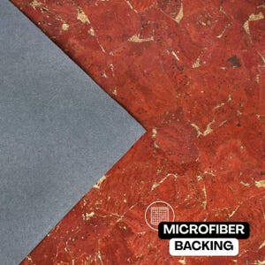 May include: A sheet of red cork fabric with a natural textured pattern and gold-colored metallic flecks throughout. A triangular section of the material is folded back to reveal a solid gray microfiber backing with the text MICROFIBER BACKING.