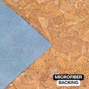 May include: Close-up of a textured cork surface with a light blue microfiber backing. The image shows a corner of the blue backing against the brown cork. The text "MICROFIBER BACKING" is displayed in a white font on a black background.
