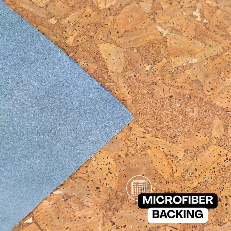 May include: Close-up of a textured cork surface with a light blue microfiber backing. The image shows a corner of the blue backing against the brown cork. The text "MICROFIBER BACKING" is displayed in a white font on a black background.