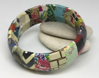 Upcycled bangle decoupaged with magazine paper. Paper jewellery. Stocking filler. Gift for her. Paper bracelet. Ready to ship.