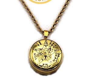 May include: Gold-toned necklace with a round pendant featuring an engraved design. The pendant hangs from a rope chain. The necklace has an adjustable length and a lobster clasp. The pendant has the text "KSC KING SOLOMON COIN".