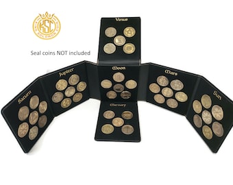 May include: A black leather coin album with eight sections, each labeled with a planet or celestial body: Saturn, Jupiter, Moon, Mercury, Mars, Venus, Sun. Each section has a grid of nine spaces for coins. The album is closed, showing the front cover with the text "King Solomon Coin".