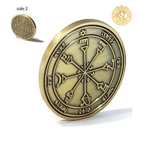 May include: A gold-colored metal coin with a star of David and Hebrew text on one side. The other side features a circular design with six spokes radiating from the center. The coin is labeled "King Solomon Coin".