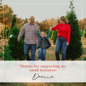 May include: A family of three, a man, a woman, and a young boy, are walking through a Christmas tree farm. The man is wearing a red and black plaid shirt, the woman is wearing a red sweater, and the boy is wearing a blue and black plaid shirt. The family is smiling and having fun. The text "Thanks for supporting my small business! Deanna" is at the bottom of the image.