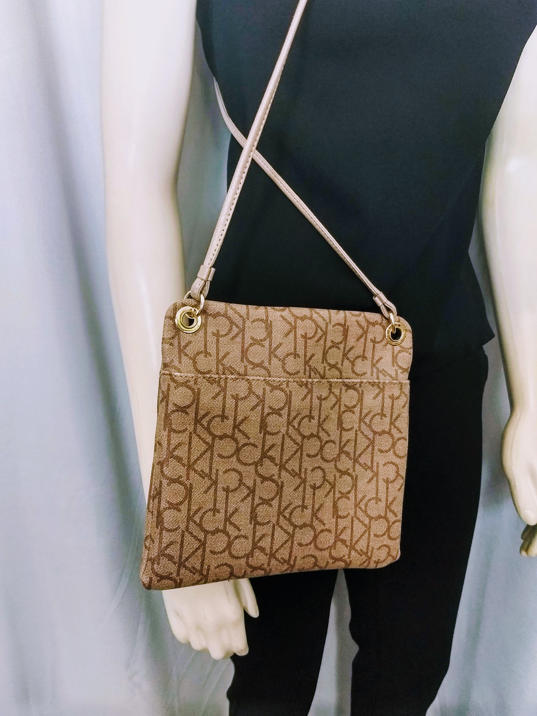 Calvin Klein Round Signature Crossbody in Brown