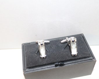 May include: A pair of silver cufflinks with a clear glass design. The cufflinks are in a black box.