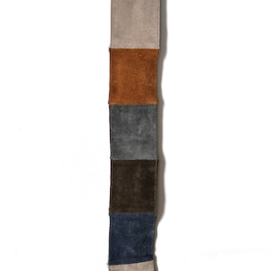 Vintage mockabälte i lapptäcke: 90-tals boho läderaccessoar (S/XL)