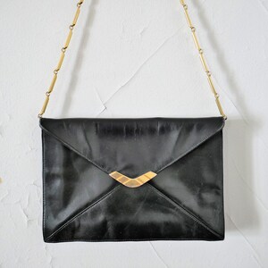 chaîne vintage années 80 vrai vintage épaule essentiel noir esthétique minimaliste unisexe