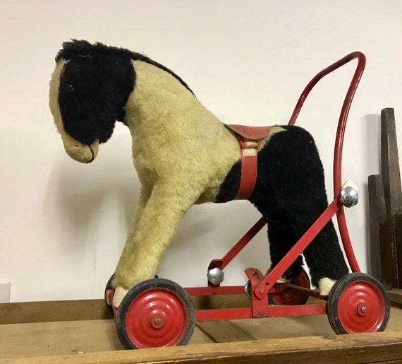 push along dog on wheels