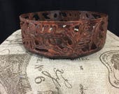 Metal, large candle holder, with elaborate and exquisite leaf detail. 6 1 2 quot across x 2 3 4 quot Height. Rust color. Made in India.