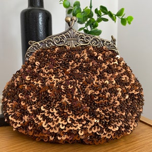 MILLENI bruine handtas met lovertjes....